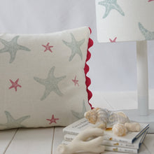 Load image into Gallery viewer, Block printed recycled linen cushion with pompoms - starfish design