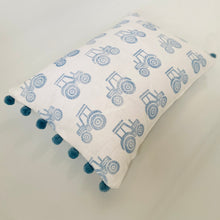 Load image into Gallery viewer, Block printed recycled linen cushion with pompoms - farmyard tractor design