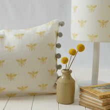 Load image into Gallery viewer, Block printed recycled linen cushion with pompoms - honey bee design
