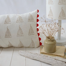 Load image into Gallery viewer, Block printed recycled linen cushion with pompoms - sail boat design
